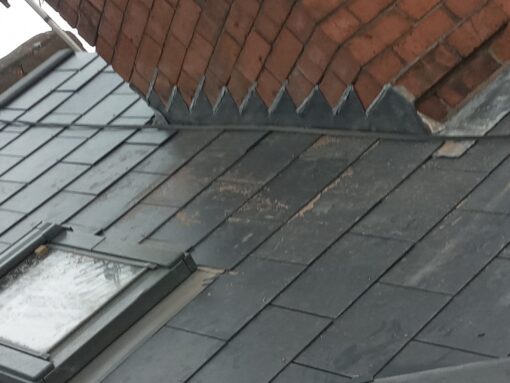 This is a photo of replaced lead flashing near a chimney stack. The work was done by Leicester roofing services