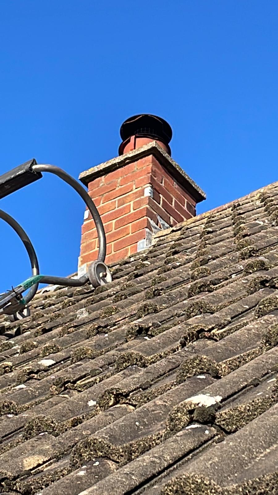 This is a photo of a chimney that needed flaunching. The work was carried out by Leicester Roofing services